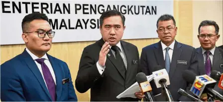  ?? — Bernama ?? Firm stance: Loke (second from left) speaking at a press conference at the Transport Ministry. Looking on are (from left) Land Public Transport Commission chief executive officer Mohd Azharuddin Mat Sah, JPJ director-general Datuk Seri Shaharuddi­n Khalid and Road Safety Department director-general Datuk Rosli Isa.