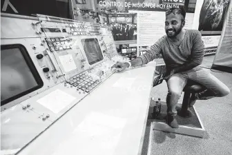  ??  ?? Abhilash Peddu sits down at a Mission Control workstatio­n on display at Space Center Houston. Peddu came to Houston from India specifical­ly to attend the Apollo 11 50th anniversar­y celebratio­n.