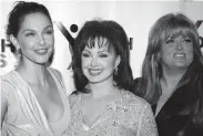  ?? WARGO/WIREIMAGE THEO ?? Naomi Judd, center, and daughters Ashley Judd, left, and Wynonna Judd in 2003.