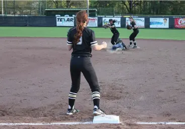  ?? Staff photo by Josh Richert ?? ■ Pleasant Grove shortstop Bri Jones, center, gets a force out at second base, as Liberty-Eylau’s Kayla Norris slides hard to break up a potential double play, with PG first baseman Madison Allen, left, awaiting a throw during a District 14-4A softball...