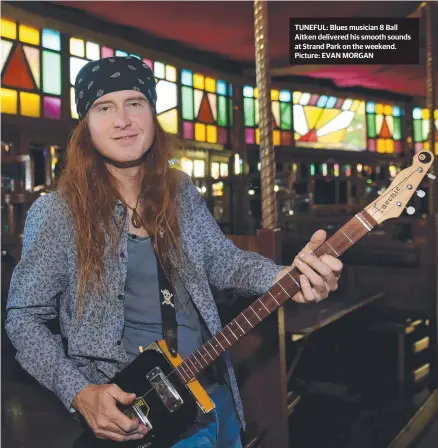  ??  ?? TUNEFUL: Blues musician 8 Ball Aitken delivered his smooth sounds at Strand Park on the weekend. Picture: EVAN MORGAN