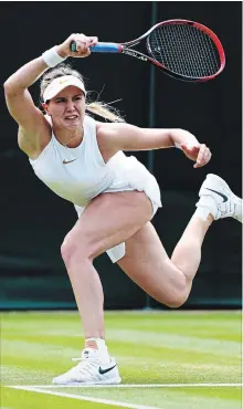  ?? MATTHEW LEWIS GETTY IMAGES ?? Canada’s Eugenie Bouchard returns a shot to Ashleigh Barty of Australia in their second-round match at Wimbledon on Thursday.