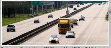  ?? — Bernama ?? Precious cargo: The first delivery of 312,390 doses of Covid-19 Pfizer-BioNTech vaccine being unloaded from a Malaysia Airlines plane at KLIA. (Inset) The vaccine being transporte­d under police security.