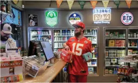  ?? Photograph: Arin Yoon/Reuters ?? A man buys beer ahead of the first NFL game of the season in Leavenwort­h, Kansas, on 10 September 2020.