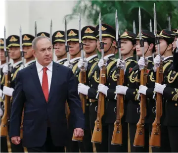  ?? (Jason Lee/Reuters) ?? PRIME MINISTER Benjamin Netanyahu inspects an honor guard in Beijing on Monday. Netanyahu created plenty of important news during the trip, but with the talk of elections, the media’s attention was elsewhere.