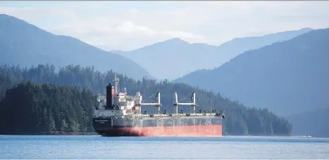  ?? BEN NELMS/BLOOMBERG FILES ?? A bulk carrier sits moored near the port in Prince Rupert, B.C. Vancouver-based Eagle Spirit is working with private landowner Roanan to establish an oil tanker port in the Alaska border town of Hyder. The federal government’s tanker ban stands in the...