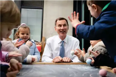 ?? (PA) ?? Ironically, on the biggest day of his profession­al life thus far, Jeremy Hunt had to bring his own children in to work with him
