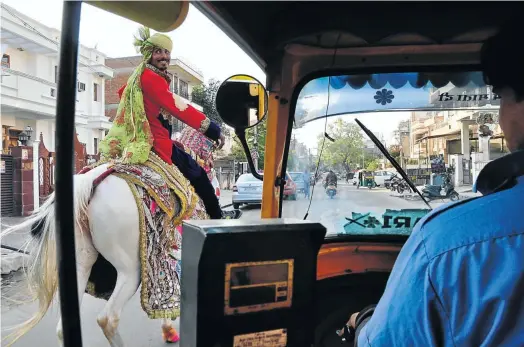  ??  ?? TURBAN ENGINE Traffic in Jaipur is a mad agglomerat­ion of cars, bicycles, tuk-tuks, motorbikes and dogs, as well as the odd horseman.