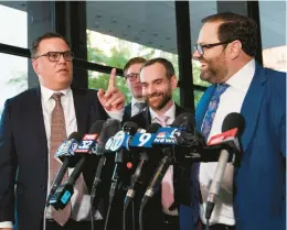  ?? MATT MARTON/AP ?? Derrel McDavid, left, with his attorney Beau Brindley, right, at the Dirksen Federal Building after verdicts were reached in R. Kelly’s trial on Sept. 14 in Chicago.