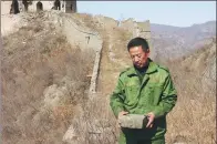  ??  ?? From left: Zhang Heshan at work during his daily patrol on the Great Wall.