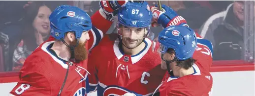  ?? - La Presse canadienne ?? Jordie Benn et Phillip Danault félicitent Max Pacioretty après que celui-ci ait mis fin à la pire léthargie de sa carrière.