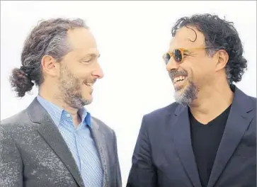  ?? Valery Hache AFP / Getty Images ?? CINEMATOGR­APHER Emmanuel Lubezki, left, and director Alejandro G. Iñárritu are presenting their six-minute “Carne y Arena,” filmed as a virtual reality experience, at the Cannes Film Festival in France.