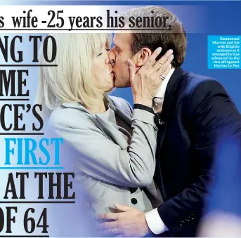  ??  ?? Emmanuel Macron and his wife Brigitte embrace as it emerged he has advanced to the run-off against Marine Le Pen