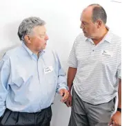  ??  ?? Corky Oglesby, left, and Bo Overton talk during the 2016 Oklahoma Basketball Coaches, Officials, Media, reunion at the CHK Central Boathouse in Oklahoma City on Thursday.