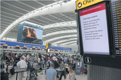  ?? AFP ?? A display warns passengers to expect disruption inside Terminal 5 of London’s Heathrow Airport on Monday.