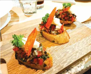  ?? ?? TRICOLOR: Bruschetta is a combinatio­n of olive bread, fresh tomatoes, Stracciate­lla cheese and basil leaves.