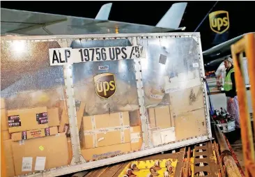  ??  ?? UPS says some package deliveries are being delayed because of a flood of orders from online shoppers.