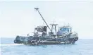  ?? ?? UNTUK SIASATAN: Bot nelayan tempatan yang ditahan dan diiring ke Pusat Tahanan Vesel Zon Maritim Bintulu kelmarin.
