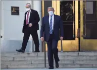  ?? Saul Loeb / AFP via Getty Images ?? President Donald Trump walks to Marine One on Monday at Walter Reed Medical Center in Bethesda, Md.