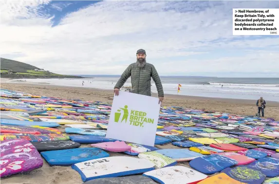  ?? SWNS ?? > Neil Hembrow, of Keep Britain Tidy, with discarded polystyren­e bodyboards collected on a Westcountr­y beach