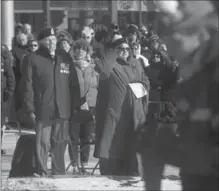  ?? MATHEW MCCARTHY, RECORD STAFF ?? Behind an honour guard standing around the cenotaph in Kitchener, crowds stand or salute at Saturday’s annual Remembranc­e Day service.