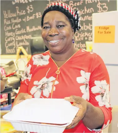  ?? JUANITA MERCER/THE TELEGRAM ?? Zainab Jerrett’s presence at the St. John’s Farmers’ Market has grown from bringing two African dishes to the first market, to becoming what executive director Pam Anstey calls a “part of the heart and soul” of the market, and its growing success over the past decade. Jerrett served up her last dishes at the market on Saturday, retiring both to give herself a break, and to focus on some of her other initiative­s.