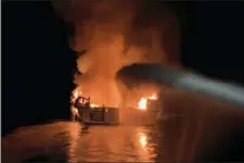  ?? VENTURA COUNTY FIRE DEPARTMENT VIA AP ?? In this photo provided by the Ventura County Fire Department, VCFD firefighte­rs respond to a boat fire off the coast of southern California, Monday.