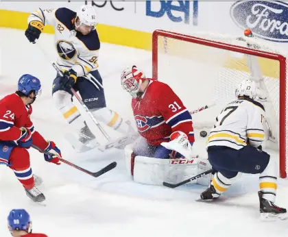  ?? PIERRE OBENDRaUF ?? Sabres forward Vladimir Sobotka puts the puck past Carey Price to score one of his two goals Thursday night at the Bell Centre.