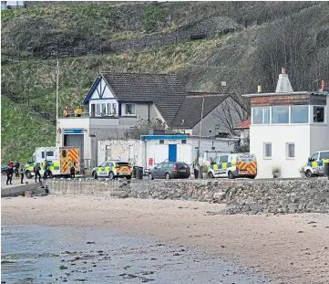  ?? ?? RISKS: Crews at Kinghorn, where one victim died in the water in April.