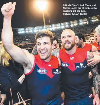  ??  ?? GRAND PLANS: Jack Viney and Nathan Jones are all smiles after knocking off the Cats. Picture: JULIAN SMITH