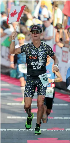  ??  ?? Pierre Heynemand Jr. finishing in Kona 2017 LEFT