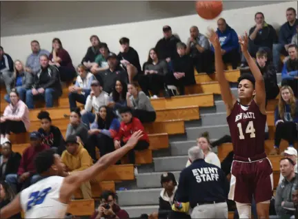  ?? TANIA BARRICKLO- DAILY FREEMAN ?? Justin DeMaria of New Paltz puts up a shot during the Section 9 Class A boys basketball championsh­ip game on Saturday, March 7, 2020.