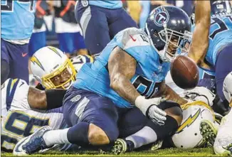  ?? Robert Gauthier Los Angeles Times ?? CHARGERS RUNNING BACK Melvin Gordon can only watch as Titans defensive lineman Jurrell Casey recovers his fumble with 15 seconds left. Gordon was originally ruled down by contact.