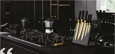  ??  ?? With a moodiness that evokes an emotionall­y contemplat­ive space to cook, the dark and sophistica­ted ebony black kitchen is a timeless
investment that will not date.