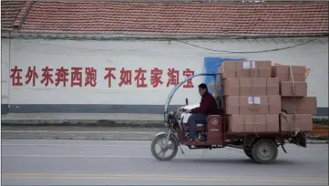  ?? PROVIDED TO CHINA DAILY ?? A deliveryma­n transports goods for the 11-11 (“Double Eleven”) online shopping festival in Wantou village, Boxing county, Binzhou city, in East China’s Shandong province, in November 2016.