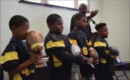  ?? BRIANA CONTRERAS — THE MORNING JOURNAL ?? Young players of Lorain Steel City Youth Football Mentorship Program are acknowledg­ed during a celebratio­n for the 23rd Anniversar­y of the Million Man March and the Holy Day of Atonement on Oct. 20 at Lorain Historical Society.