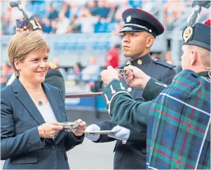  ??  ?? First Minister Nicola Sturgeon, seen at the Edinburgh Tattoo as official salute taker, said she would be ‘more than happy to band together with a bunch of other women’