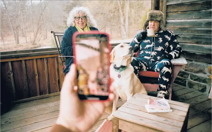  ?? DANIEL ARNOLD/THE NEW YORK TIMES ?? Mandy Patinkin and Kathryn Grody film a video with their dog, Becky, on Jan. 18 at their upstate New York home where they’ve been spending the pandemic.