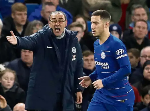  ??  ?? You want in or out?: Chelsea manager Maurizio Sarri (left) shouting instructio­ns to Eden Hazard during the Premier League match against Leicester at Stamford Bridge on Dec 22. — AP