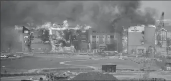  ?? (Trevor Hughes/USA TODAY NETWORK via REUTERS) ?? Structures burn, including an Element Hotel, as a wind-driven wildfire forced evacuation of the Superior suburb of Boulder, Colorado, U.S. December 30, 2021.