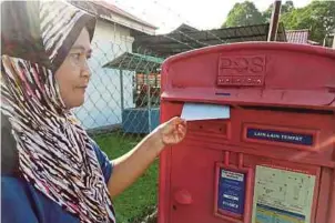  ??  ?? Junaidah Abdul Razak posting a Hari Raya greeting card.