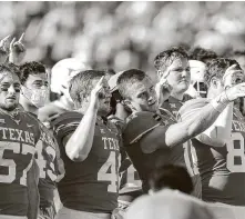  ?? TimWarner / Getty Images ?? New Texas coach Steve Sarkisian says he plans for his players to continue singing the controvers­ial “Eyes of Texas.”