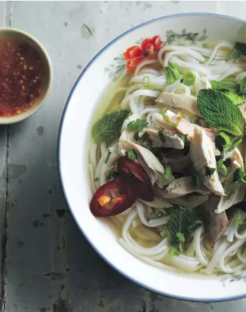  ?? JOHN LEE ?? “Great for pho beginners, this recipe is also terrific for cooks in a hurry. It involves less than 45 minutes, during which you’ll doctor up store-bought broth,” Andrea Nguyen writes of her quick chicken pho recipe.