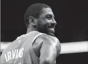  ?? ASSOCIATED PRESS ?? BOSTON CELTICS’ KYRIE IRVING (11) smiles in the first half of an Oct. 11 preseason game against the Charlotte Hornets in Charlotte, N.C.