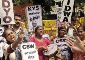  ?? — PRITAM BANDYOPADH­YAY ?? Activists of various women’s organisati­ons protest against the alleged gang- rape of a 19- year- old girl from Rewari, outside Haryana Bhawan in New Delhi on Monday.