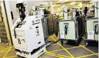  ??  ?? Robots are used in Scottish hospitals to ferry linen and meals and even to dispense drugs