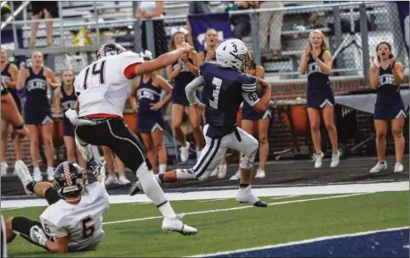  ??  ?? Gordon Lee's Drew Cobb sprints past LaFayette's Logan Teasley (14) and Dakota Cathey (6) on his way for a touchdown. Cobb found the end zone four times in the Trojans' 35-20 victory on Friday. (Photo by Greg Collins/collinspic­tures.com)