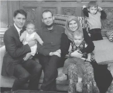  ??  ?? A photo posted to Twitter showing Prime Minister Justin Trudeau with Joshua Boyle and his family, a week before Christmas. TWITTER.COM / BOYLESVSWO­RLD