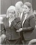  ?? Steve Gonzales / Houston Chronicle ?? Sandra Melgar, left, a 57-year-old widow accused of killing her husband in 2012 and trying to cover it up, listens to opening arguments.