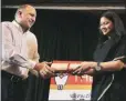  ?? Prem Nath Pandey ?? Mehta hands over the award to Neha Dixit Wednesday.